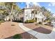 Well-maintained multi-Gathering home boasts manicured landscaping, enhancing curb appeal and creating a welcoming atmosphere at 5211 Caspian Springs Dr # 201, Las Vegas, NV 89120