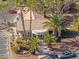 Beautiful exterior with tropical landscaping, a tile roof, and ample parking in a well-maintained community setting at 5211 Caspian Springs Dr # 201, Las Vegas, NV 89120
