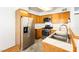 Open kitchen boasts stainless steel appliances, ample cabinets, and double basin sink at 5211 Caspian Springs Dr # 201, Las Vegas, NV 89120