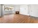 Inviting living room with laminated wood flooring, balcony access, and cozy fireplace perfect for relaxation at 5211 Caspian Springs Dr # 201, Las Vegas, NV 89120
