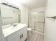 Modern bathroom boasts a sleek vanity and a glass enclosed shower at 5222 Mandalay Springs Dr # 202, Las Vegas, NV 89120