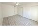 Open bedroom with ample closet space and wood look flooring at 5222 Mandalay Springs Dr # 202, Las Vegas, NV 89120