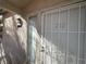 Close up of the front door to unit 202 with security screen and window at 5222 Mandalay Springs Dr # 202, Las Vegas, NV 89120