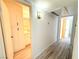 Hallway with wood floors leads to a storage closet and the bathroom at 5222 Mandalay Springs Dr # 202, Las Vegas, NV 89120