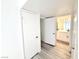 Bright hallway leads to an updated bathroom and bedroom at 5222 Mandalay Springs Dr # 202, Las Vegas, NV 89120