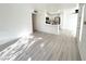 Open concept living area with light wood flooring, kitchen view, and lots of natural light at 5222 Mandalay Springs Dr # 202, Las Vegas, NV 89120