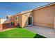 Backyard featuring gravel, artificial turf and covered patio at 5292 Cholla Cactus Ave, Las Vegas, NV 89141