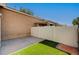 Backyard featuring gravel, artificial turf and covered patio at 5292 Cholla Cactus Ave, Las Vegas, NV 89141