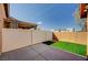 Enclosed patio with privacy fence and artificial turf at 5292 Cholla Cactus Ave, Las Vegas, NV 89141
