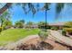 Beautifully landscaped community park with lush green grass, mature trees, seating, and pathways for residents to enjoy at 5292 Cholla Cactus Ave, Las Vegas, NV 89141