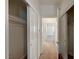 Hallway featuring closet space leading towards a bedroom with natural light at 5292 Cholla Cactus Ave, Las Vegas, NV 89141