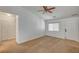 Spacious living room featuring neutral carpet, bright natural light, and a ceiling fan with a light at 5292 Cholla Cactus Ave, Las Vegas, NV 89141