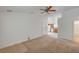 Bright living room with partial view of the kitchen, featuring updated appliances and plenty of natural light at 5292 Cholla Cactus Ave, Las Vegas, NV 89141