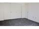 A bedroom featuring gray carpeting and a closet with sliding doors at 555 E Silverado Ranch Blvd # 2005, Las Vegas, NV 89183