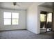 Bright living room featuring neutral walls, carpeting and a sliding glass door at 555 E Silverado Ranch Blvd # 2005, Las Vegas, NV 89183