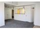 Spacious living room with plush gray carpeting and neutral walls at 555 E Silverado Ranch Blvd # 2005, Las Vegas, NV 89183