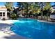 Community pool surrounded by mature trees at 555 E Silverado Ranch Blvd # 2005, Las Vegas, NV 89183