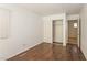 Bedroom with wood flooring, a window and sliding closet doors at 5935 Stone Hollow Ave, Las Vegas, NV 89156