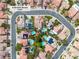 Overhead aerial view of home includes a large pool, solar panels, and a neat backyard at 6 Desert Dawn Ln, Henderson, NV 89074