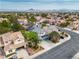 Expansive aerial view showcases a well-planned community, nearby mountains, and neighborhood at 6 Desert Dawn Ln, Henderson, NV 89074