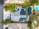 Breathtaking aerial view showcases home with solar panels, sparkling pool, and surrounding landscape at 6 Desert Dawn Ln, Henderson, NV 89074