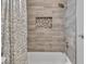Modern tiled shower and tub combination with brushed nickel fixtures at 6 Desert Dawn Ln, Henderson, NV 89074