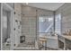 Contemporary bathroom featuring a soaking tub, walk-in shower, and stone flooring at 6 Desert Dawn Ln, Henderson, NV 89074
