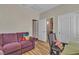 Bedroom featuring wood floors, a comfortable sofa, and closet space at 6 Desert Dawn Ln, Henderson, NV 89074