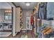 Walk-in closet and bathroom featuring custom shelving and a large mirror at 6 Desert Dawn Ln, Henderson, NV 89074
