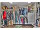 Spacious walk-in closet with custom shelving and storage solutions for organization at 6 Desert Dawn Ln, Henderson, NV 89074