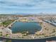 A panoramic aerial view of the community lake and desert landscape under a blue sky at 6 Desert Dawn Ln, Henderson, NV 89074