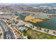 Aerial view of park buildings, parking and lake for this desert community at 6 Desert Dawn Ln, Henderson, NV 89074