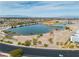 Scenic aerial view captures a serene lake and surrounding landscape with distant city views at 6 Desert Dawn Ln, Henderson, NV 89074