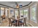 Bright dining area featuring tile floors, plantation shutters, and a modern ceiling fan at 6 Desert Dawn Ln, Henderson, NV 89074
