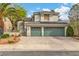 Charming two-story home with a three-car garage and well-maintained landscaping at 6 Desert Dawn Ln, Henderson, NV 89074
