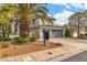 Beautiful two-story house featuring a lush front yard and a spacious driveway at 6 Desert Dawn Ln, Henderson, NV 89074