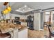 Stylish kitchen with modern appliances, granite countertops, and a breakfast bar, perfect for casual dining at 6 Desert Dawn Ln, Henderson, NV 89074