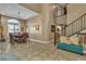 Spacious living area with a dining table and staircase at 6 Desert Dawn Ln, Henderson, NV 89074