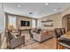 Inviting living room with tile floors, recessed lighting, and a comfortable seating arrangement at 6 Desert Dawn Ln, Henderson, NV 89074