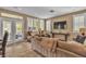 Spacious living room featuring tile floors, recessed lighting, and access to the backyard at 6 Desert Dawn Ln, Henderson, NV 89074
