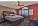 Comfortable main bedroom with hardwood floors, large windows, and a ceiling fan at 6 Desert Dawn Ln, Henderson, NV 89074