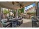Comfortable covered outdoor patio with furniture and built-in grill at 6 Desert Dawn Ln, Henderson, NV 89074