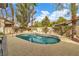Backyard pool surrounded by landscaping and hardscape at 6 Desert Dawn Ln, Henderson, NV 89074