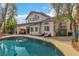 Backyard pool, patio, and covered outdoor kitchen area at 6 Desert Dawn Ln, Henderson, NV 89074