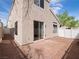 A quaint backyard with a stone patio and low-maintenance landscaping at 6237 Glimmering Light Ave, Las Vegas, NV 89139