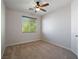An inviting bedroom featuring neutral walls, plush carpet, and a ceiling fan at 6237 Glimmering Light Ave, Las Vegas, NV 89139