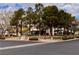 Picturesque community park with mature trees and inviting walking paths at 6237 Glimmering Light Ave, Las Vegas, NV 89139