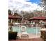 Sparkling community pool area with sunshades and comfortable lounge chairs at 6237 Glimmering Light Ave, Las Vegas, NV 89139