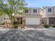 Charming two-story home featuring a two car garage, and nicely landscaped front yard at 6237 Glimmering Light Ave, Las Vegas, NV 89139
