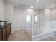 Upstairs hallway featuring an overlook and built-in storage cabinets at 6237 Glimmering Light Ave, Las Vegas, NV 89139